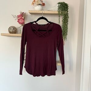 Burgundy long sleeve top with cross over pattern front